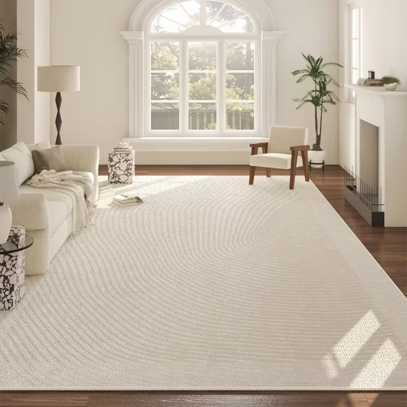 Tapis de grande surface beige à motif géométrique