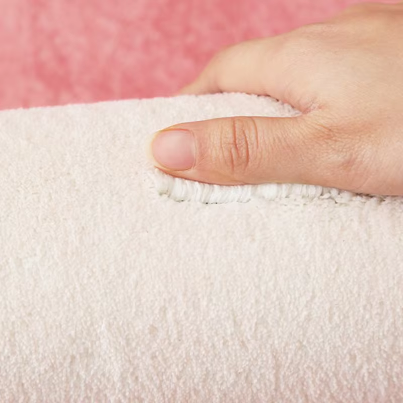 Tapis rose à motif nœud papillon pour chambre à coucher