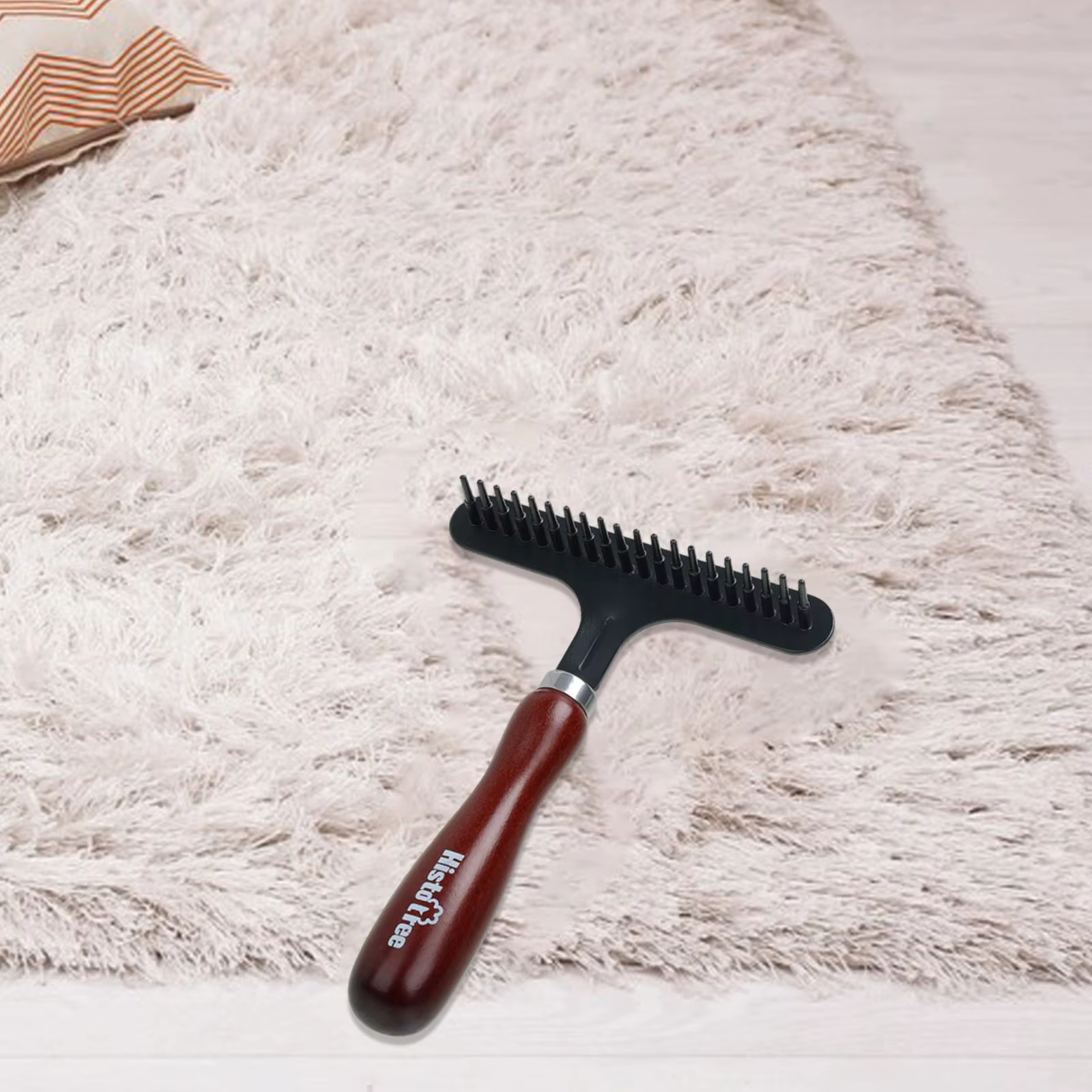 Râteau de toilettage pour tapis